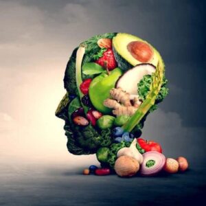 Human head made out of fruits and vegetables representing nutritherapy